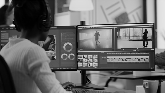 a woman is doing video editing process in her computer