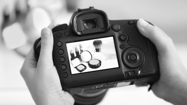 camera is taking a picture of a makeup that is on the table